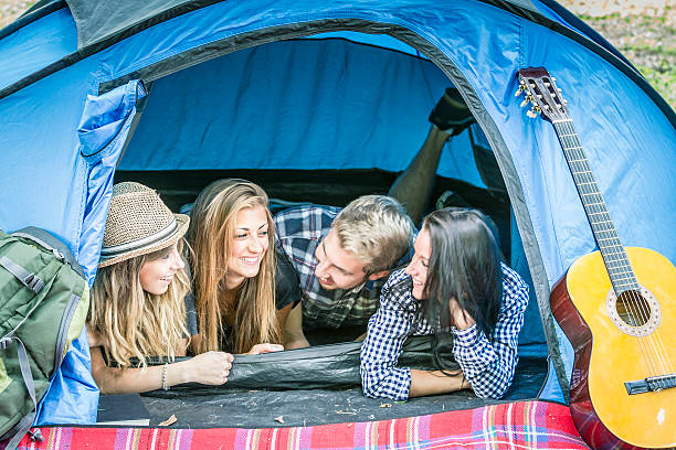 istock Group of friends having fun at camping 512287513