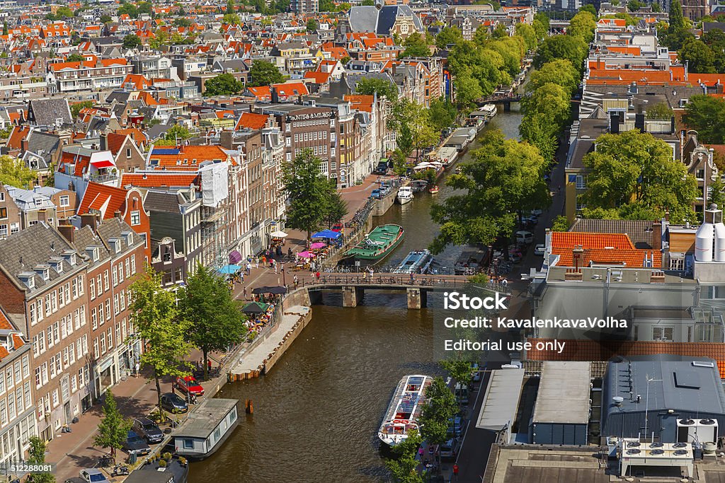 Amsterdam city view from Westerkerk, Holland, Netherlands. Amsterdam, Netherlands - August 5, 2014: Canal Prinsengracht and houses of Amsterdam. City view from the bell tower of the church Westerkerk, Holland, Netherlands. Amsterdam Stock Photo