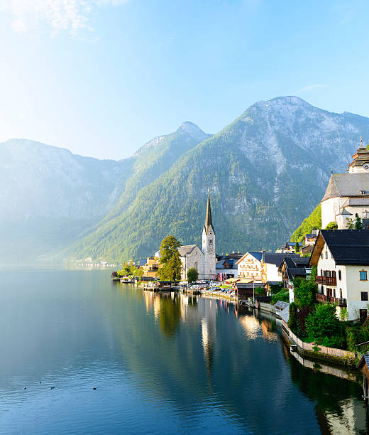 Early morning sunlight falling onto the lakeside village of Hallstatt, Austria.