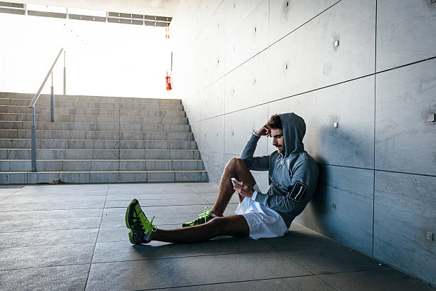 Young Adult Man Browsing The Net With Smartphone