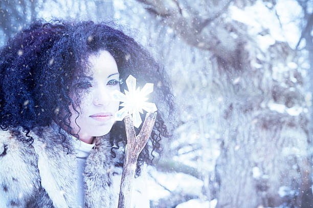 Snow Maiden With Crystal In A Winter Storm