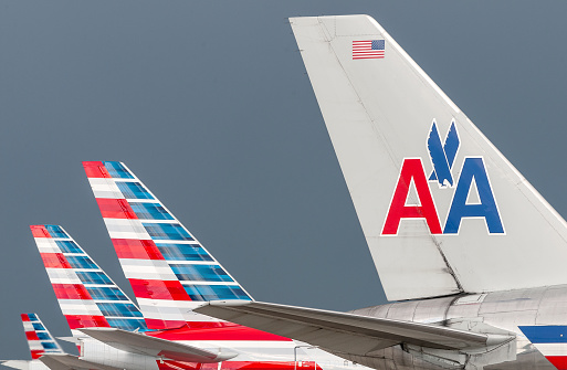 Miami, USA - September 12, 2014: The new and the old visual design of American Airlines together at Miami International Airport, Miami, Florida.