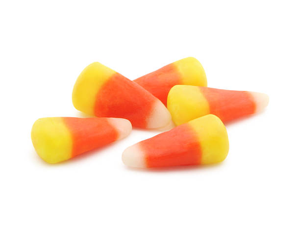 Candy Corn Candy Corn isolated on white candy corn stock pictures, royalty-free photos & images