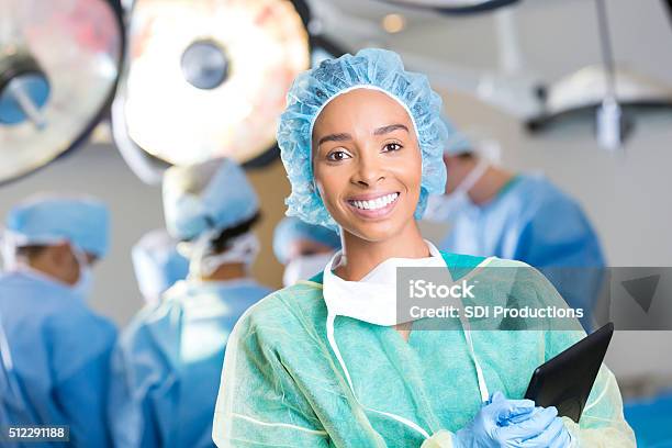 Young Surgeon Prepares For Surgery Stock Photo - Download Image Now - Surgery, Technician, Nurse