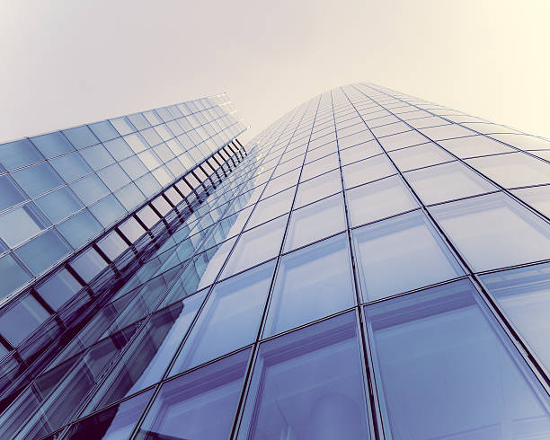 istock glass silhouettes on modern building 512291413