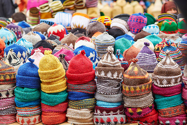 Selection of woolen hats on a traditional Moroccan market (souk) in Marrakech, Morocco