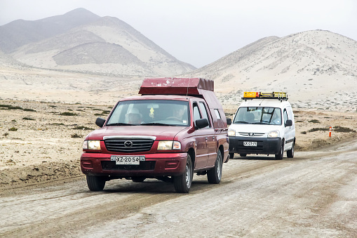 Atacama, Chile - November 18, 2015: Pickup truck Mazda B-series drives at the interurban gravel road.