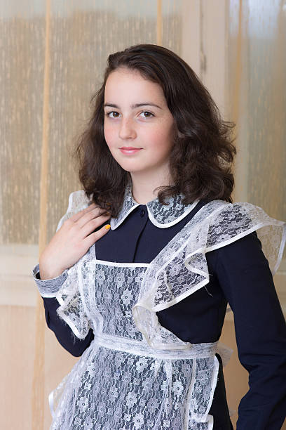 istock girl in school uniform 512292806