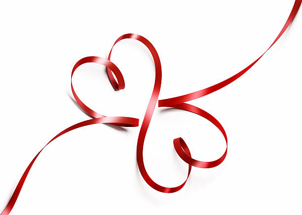 Red Silk Ribbon Forming Two Hearts Bright red ribbon that's thin and curved into the shape of two hearts. The ribbon curves around to create two hearts and is not tied. One end of the ribbon curves up and then back down, and the other curves to form the shape of a point where they overlap at the bottom. Great use for love and romance concepts. Isolated on white. Clipping path is included. seta stock pictures, royalty-free photos & images