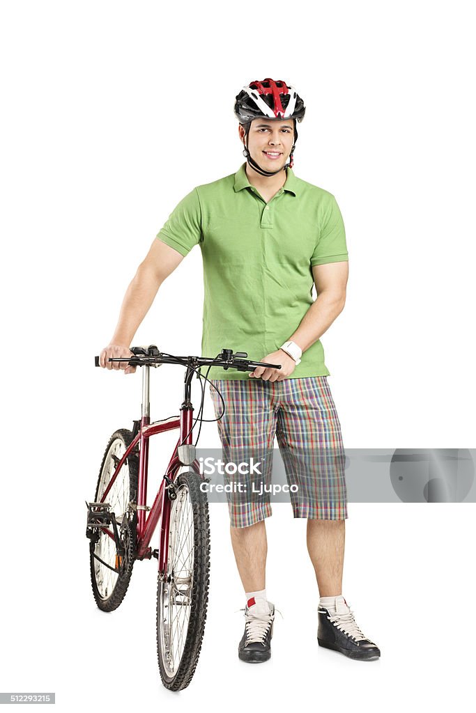 Man with helmet pushing a bike Full length portrait of a man with a helmet pushing a bike isolated on white background 20-29 Years Stock Photo