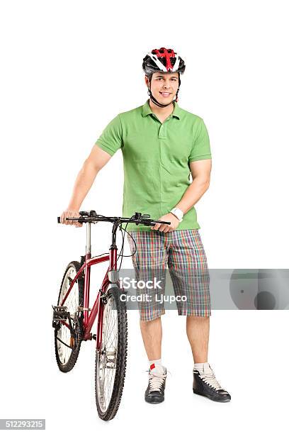 Man With Helmet Pushing A Bike Stock Photo - Download Image Now - 20-29 Years, Activity, Adult