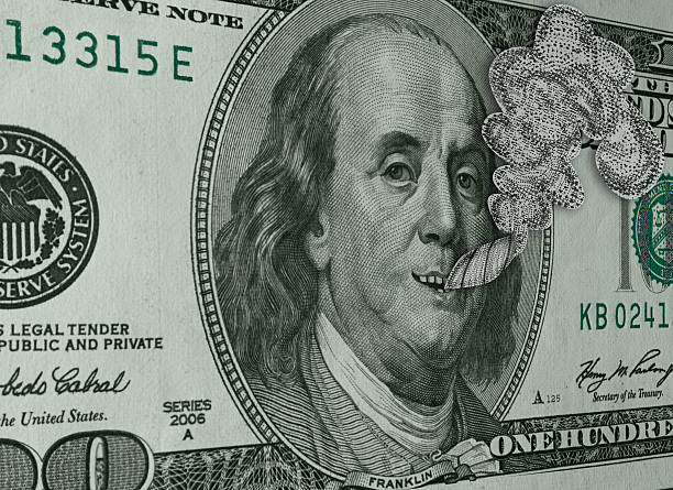 Ben Franklin Smoking Reefer and Smiling on Hundred Dollar Bill stock photo