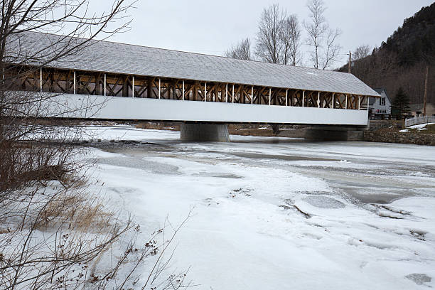 istock Historic white covered bridge, Ammonoosuc River, Stark, New Hampshire. 512294400