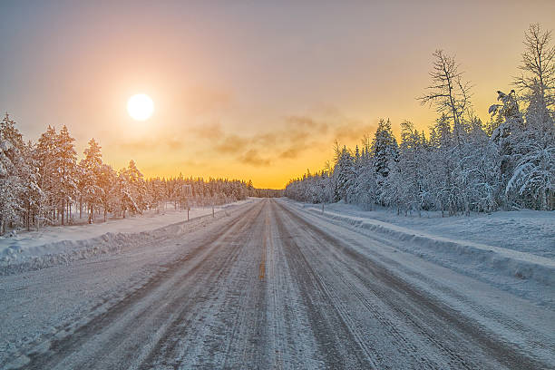 Colorful Lapland arctic day on winter road, Finland stock photo