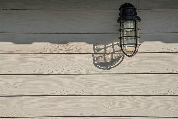 istock Old lamps mounted on a wooden wall . 512296212