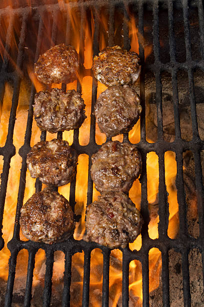 istock Beef Miniature Burger Sliders on a Fiery Grill 512298814