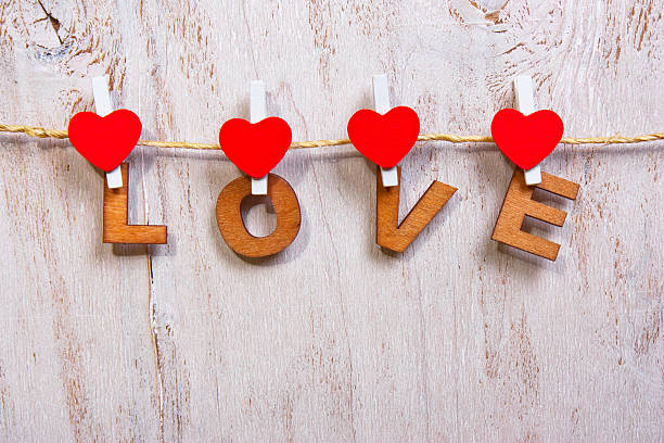 istock wood letters and heart forming word LOVE 512299532