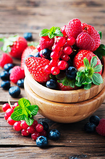 istock Mix of berry on the wooden table 512300794