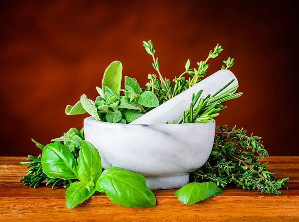 istock Pestle and Morthar with Green Basil, Mint and Rosemary 512301180