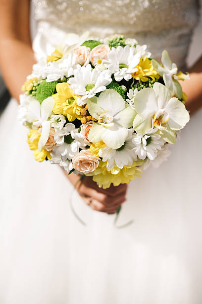 istock Bride bouquet with white roses, orchids, daisies 512301650
