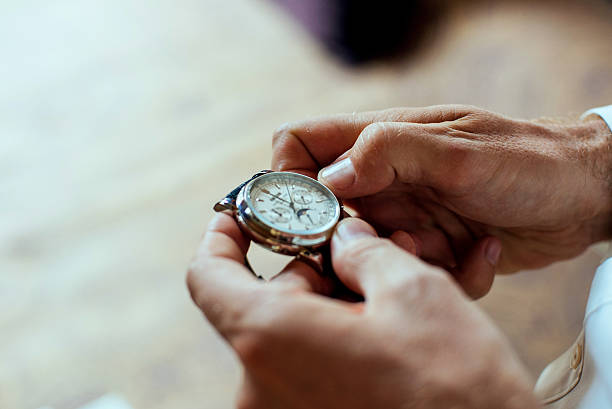 istock Businessman look his watch 512302540