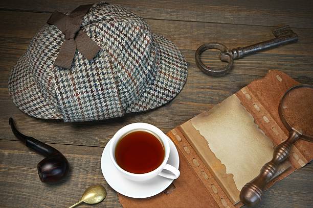 istock British Famous Detective Concept. Investigation Tools On The Wood Table 512303488