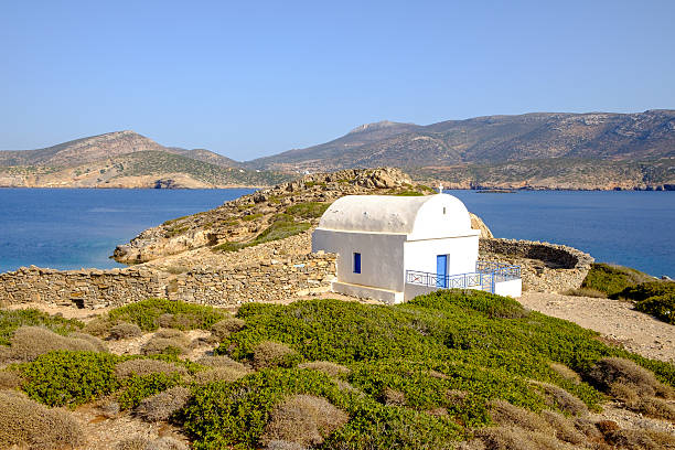 istock Landscape view of white chapel at beautiful ocean coastline, Gre 512303490