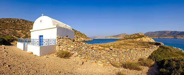 istock Panoramic view of white chapel at beautiful ocean coastline, Gre 512303586