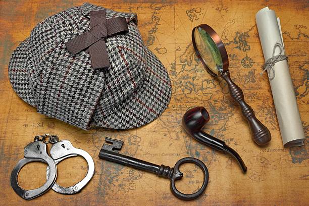 istock Overhead View Of Detective Deerstalker Hat And Tools On Map 512303704