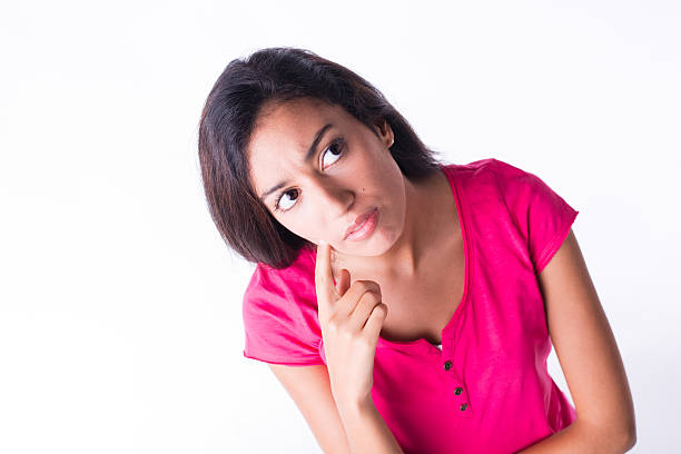 istock isolated studio shot beautiful young woman wonder attitude with finger 512310541