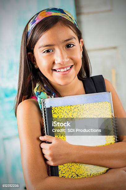 Cute Hispanic Student Holding Books Before School Starts Stock Photo - Download Image Now