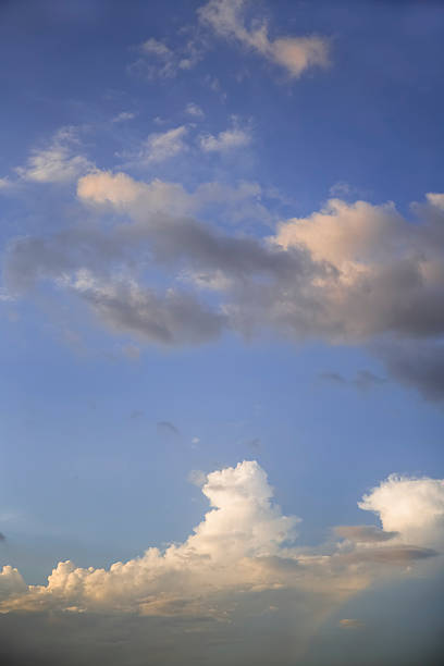 istock Blue Sky with white clouds with tinge of golden light 512320785