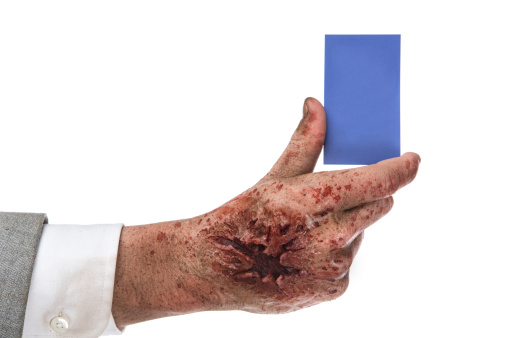 Zombie holding business card