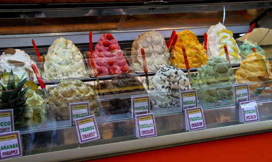 Gelato Shop, Florence, Italy showing decorative display of flavors