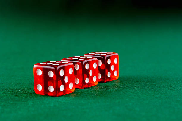 istock Three red dices in the casino 512323191