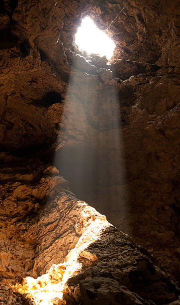 istock the orange light through hole in the cave 512323241
