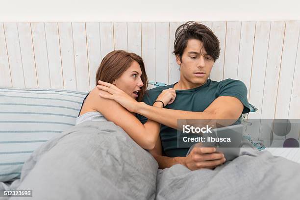 Man Rejecting Wife To Play With His Tablet Stock Photo - Download Image Now - Sex and Reproduction, Shock, Crime