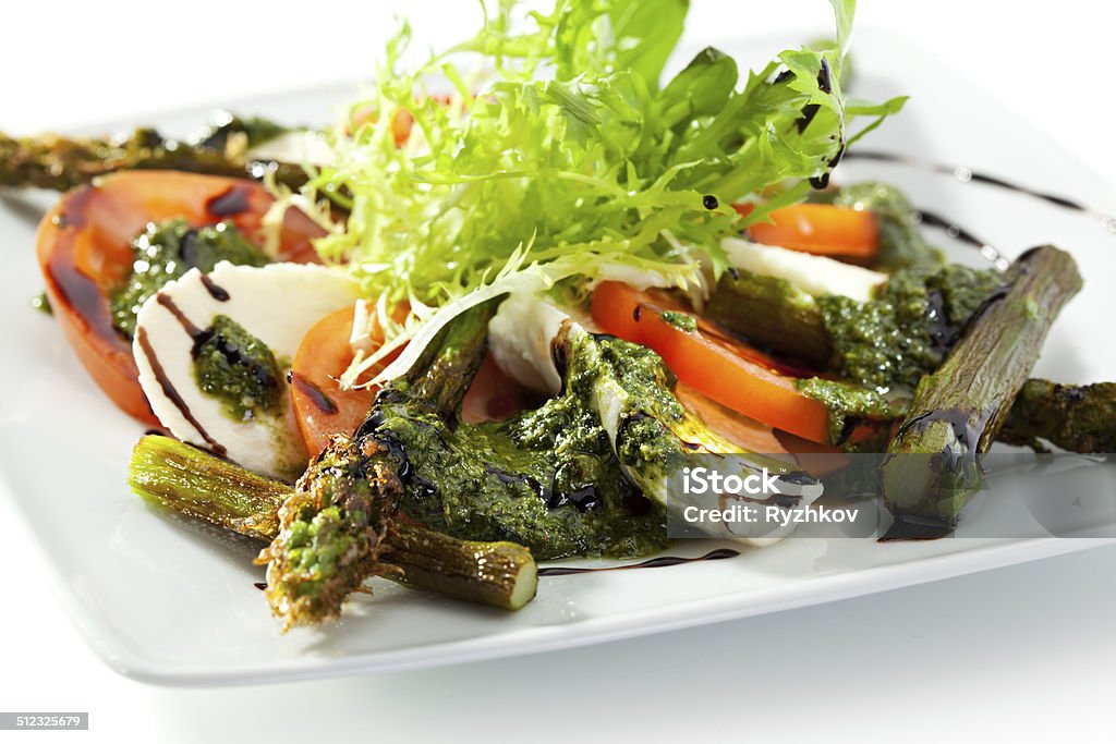 Caprese Salad Caprese Salad - Salad with Tomatoes, Mozzarella Cheese and Asparagus Appetizer Stock Photo