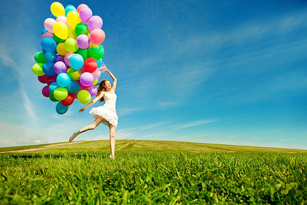 Happy Birthday Woman Against The Sky With Rainbow Air Balloons Stock Photo  - Download Image Now - iStock