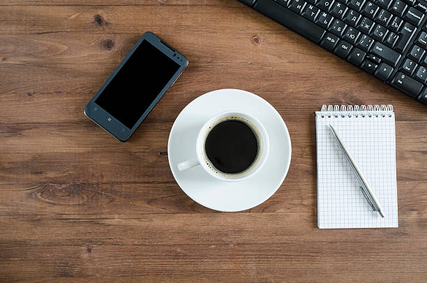 istock Black  keyboard, smart phone and office supplies 512326613