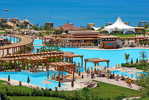 Antalya, Turkey - July 15, 2007:  Swimming pools recreation area and Mediterranean Sea view on summer luxury resort, Antalya, Turkey