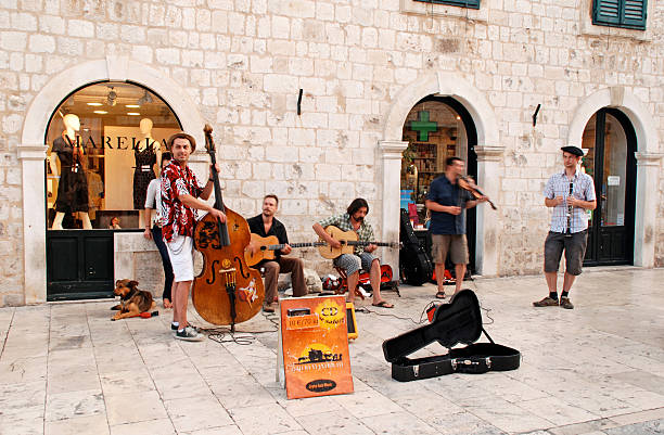 Dubrovnik, Croatia - July 21, 2011: Street musicians performing in the main street Stradun of the Old Town of Dubrovnik, Croatia.