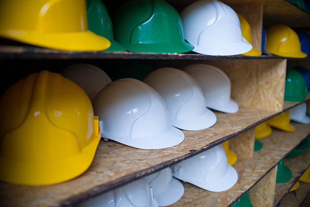 istock Yellow, white and green  safety helmet 512330378