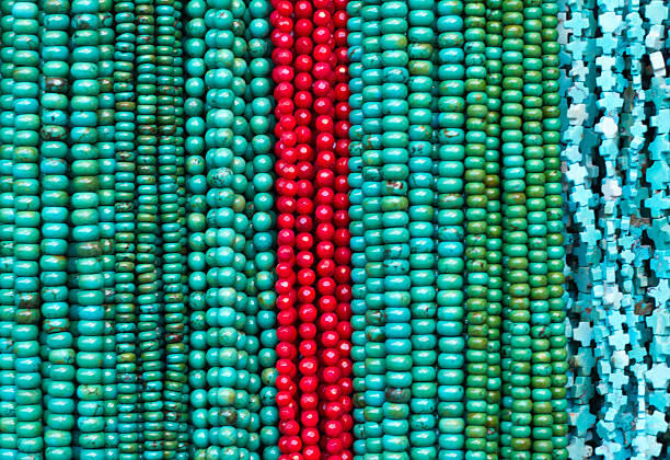 istock Turquoise and Coral Beads and Necklaces Hanging (Close-Up) 512331400
