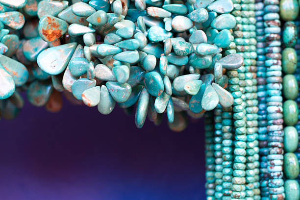 istock Turquoise Beads and Necklaces Hanging (Close-Up) 512331894