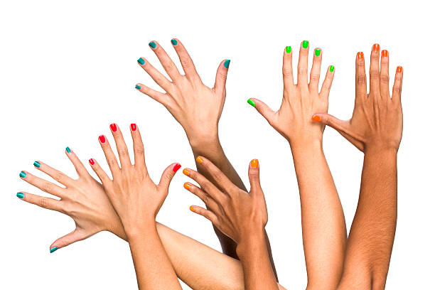 istock Group of raised multiethnics female hands with colored manicure 512331934