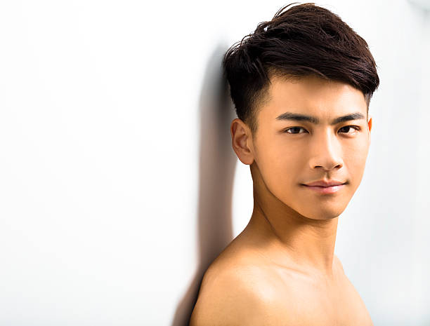 istock Closeup portrait of attractive young man face 512332810
