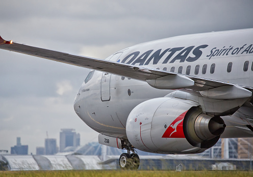 Sydney,Australia - February 20, 2016: A QANTAS Boeing 737 taxies towards the terminal after landing at the city's airport. QANTAS is the flag carrier for Australia.