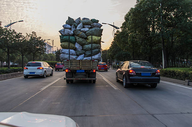 Overload Overloaded truck on road overflowing stock pictures, royalty-free photos & images