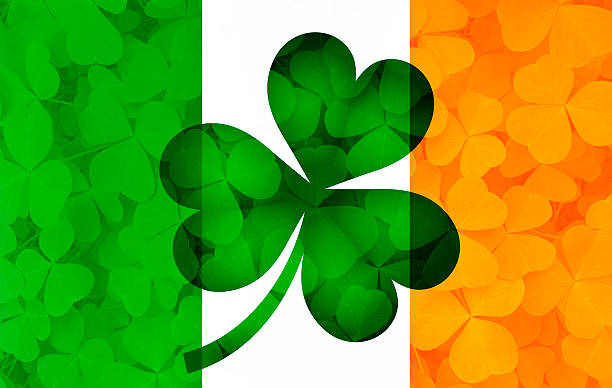 istock Ireland Flag with Shamrock Leaves Background Illustration 512337744